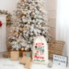 Saco Navidad personalizado Santa Express con nombre Marcos, diseño de Papá Noel, 100 % algodón ecológico, frente a árbol nevado con regalos.
